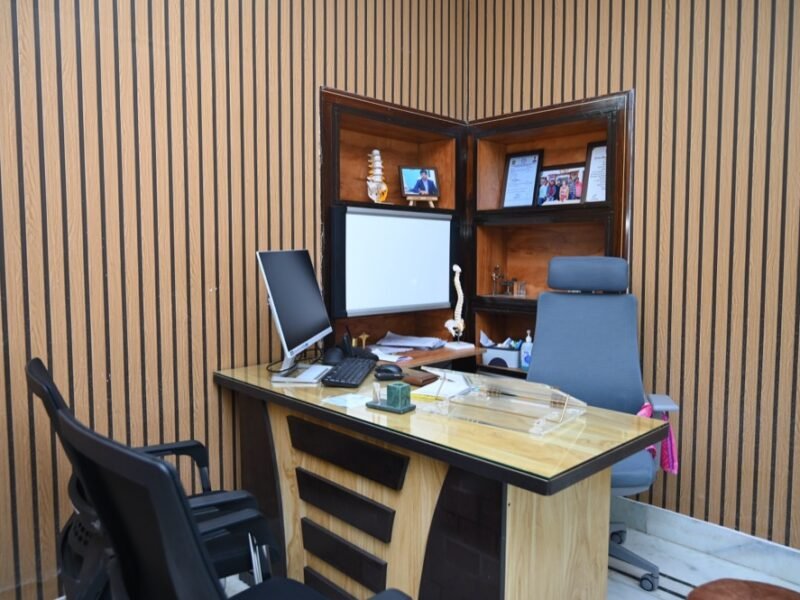 Empty consultation room with spine model