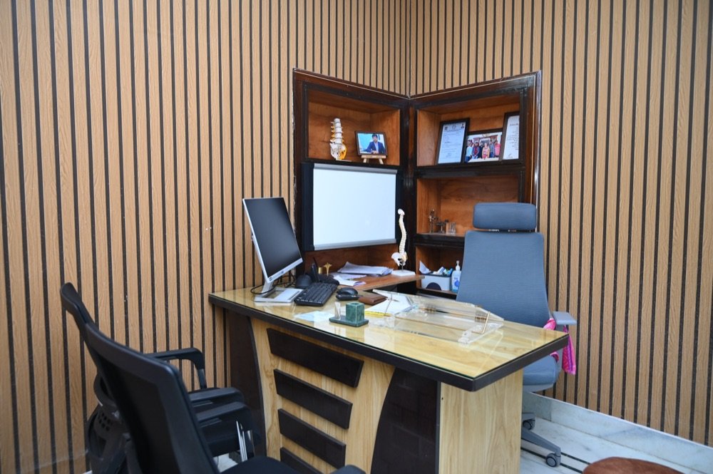 Empty consultation room with spine model