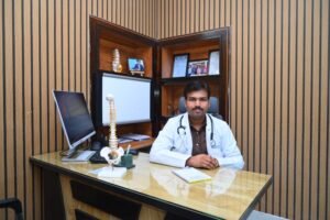Dr. Tejo Phanindra P at his consultation desk