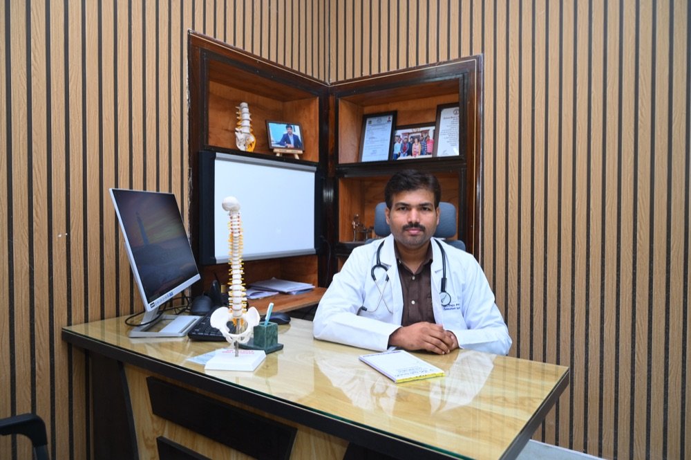 Dr. Tejo Phanindra P at his consultation desk