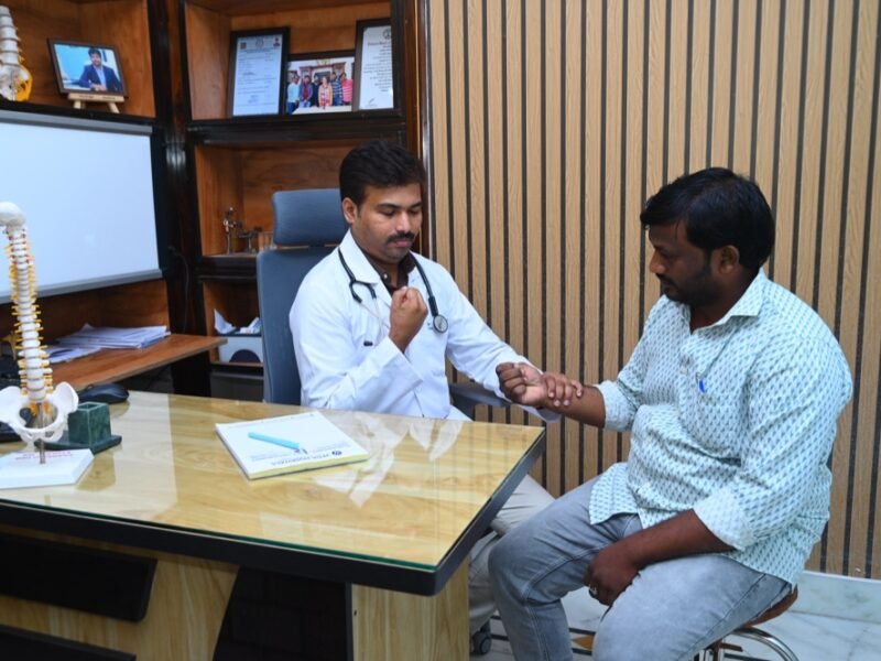 Dr. Tejo Phanindra P examining a patient
