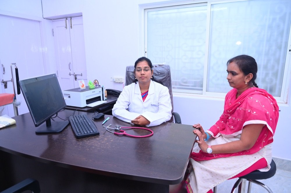 Dr. Lakshmi Mrudula V consulting a patient